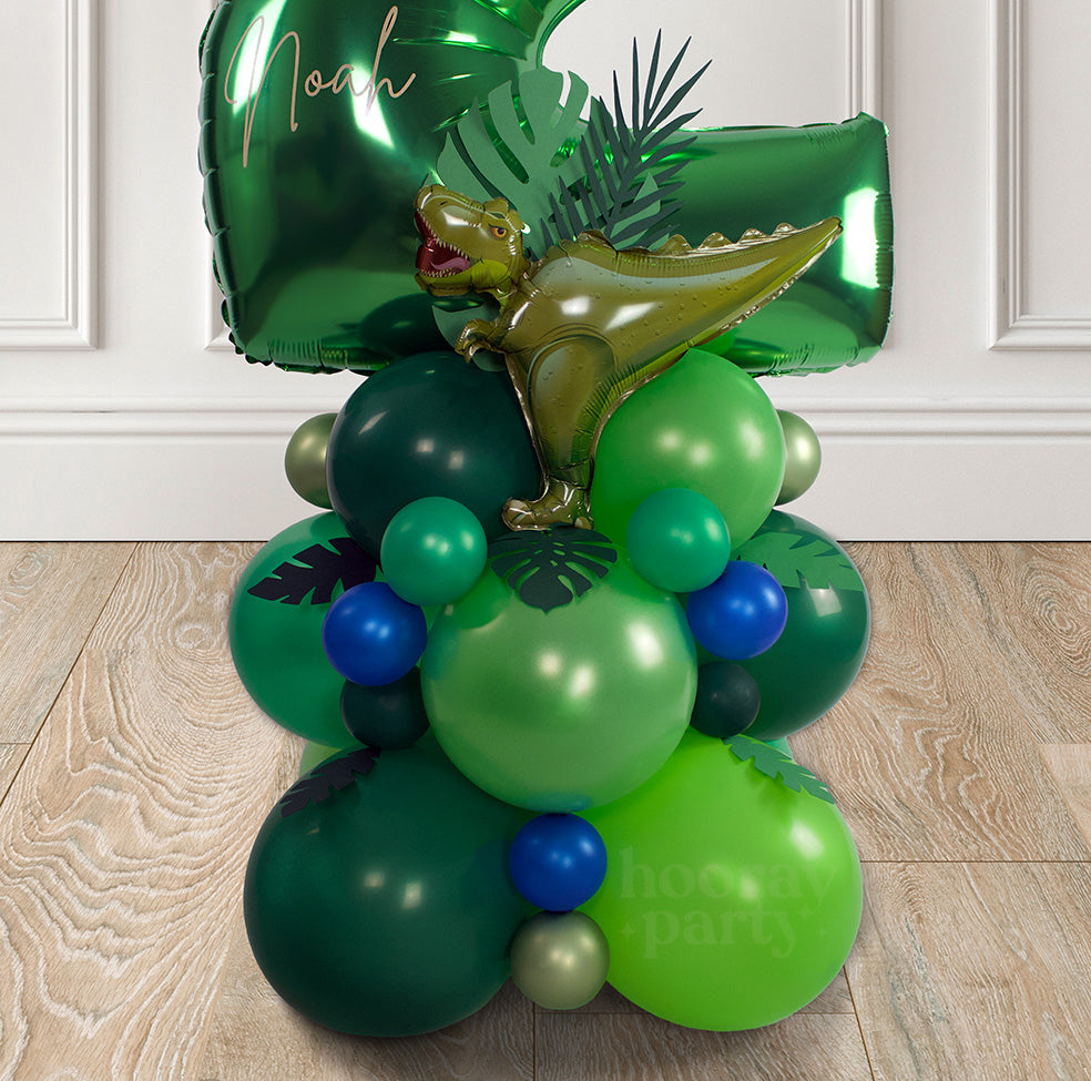 Dinosaur themed birthday party balloons in green and blue