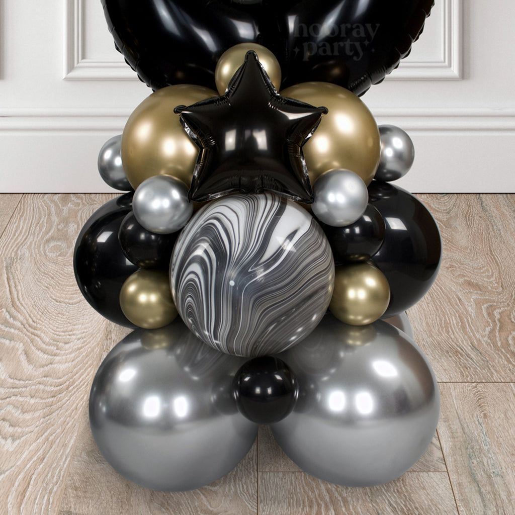 Adult personalised birthday balloon display in black, gold and silver