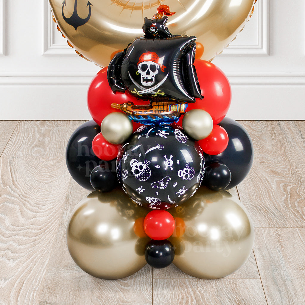 Pirate themed birthday party balloons in black, red and gold colours.
